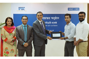 IPDC handed over a cheque to Porua to set up library at schools for the underprivileged children.