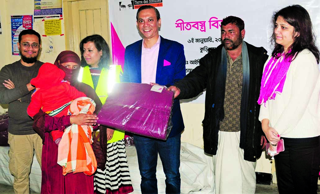 IPDC Finance PLC distributed winter clothes and nebulizers to underprivileged people in Kurigram and Rangpur